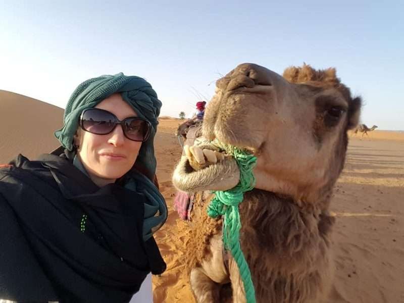 women only travel group with camel